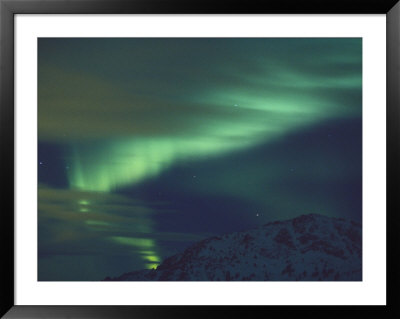 The Aurora Borealis Creates Light Patterns In The Northern Sky by Paul Nicklen Pricing Limited Edition Print image