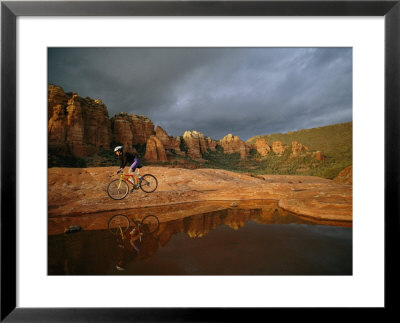 A Biker Cycles Across The Desert by Dugald Bremner Pricing Limited Edition Print image