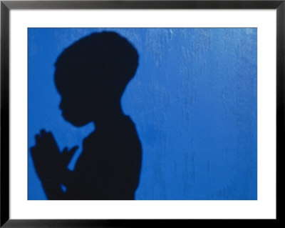 Shadow Of A Boy Praying Against A Blue Wall by Josh Mitchell Pricing Limited Edition Print image