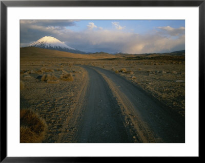 Dirt Road Winds Towards Sajama, Bolivia by Joel Sartore Pricing Limited Edition Print image