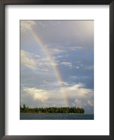 Rainbow In Sky After A Storm Over A Palm Tree-Studded Island by Wolcott Henry Pricing Limited Edition Print image
