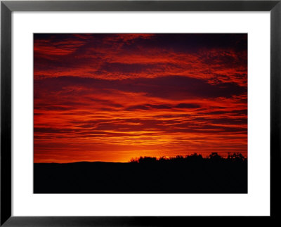 A Sunrise Bathes The Clouds In A Red Glow by Heather Perry Pricing Limited Edition Print image