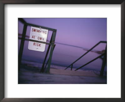 A Warning Sign For Swimmers Is Posted On The Boardwalk In Camden, Maine by Stephen Alvarez Pricing Limited Edition Print image