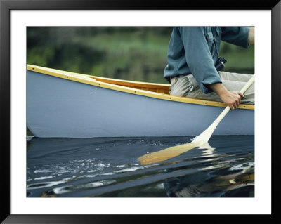 Close View Of A Person Paddling A Canoe by Bill Curtsinger Pricing Limited Edition Print image