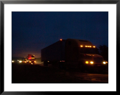 Semi Trucks At Night On The Shoulder Of I-80 by Joel Sartore Pricing Limited Edition Print image