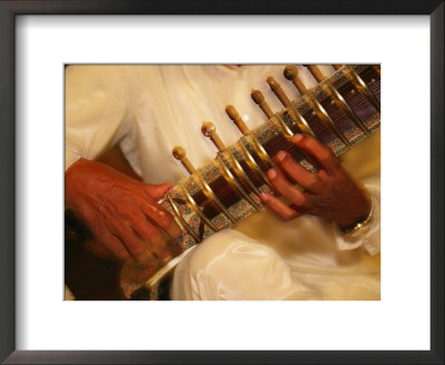 A Sitar Player With His Instrument by Michael Melford Pricing Limited Edition Print image