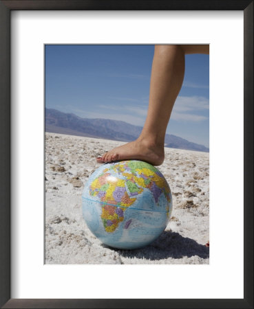 Woman's Foot On Globe, Bad Waters Point, Death Valley National Park, California, Usa by Angelo Cavalli Pricing Limited Edition Print image