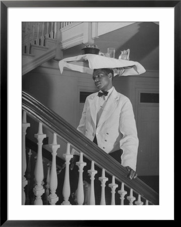 Waiter At Homestead Hotel Carrying Tray On His Head by John Phillips Pricing Limited Edition Print image