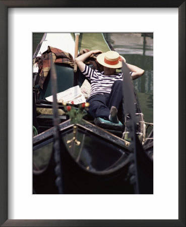 Gondolier Relaxing In Gondola, Venice, Veneto, Italy by Adam Woolfitt Pricing Limited Edition Print image