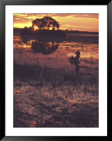 Mokoro And Guide, Botswana by Stuart Westmoreland Pricing Limited Edition Print image