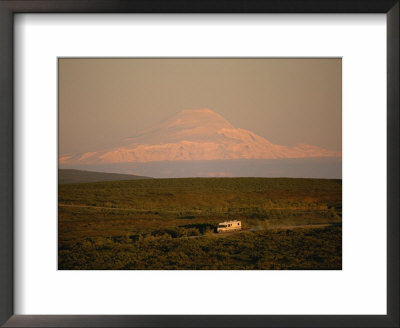 A Rv Rumbles Along The Denali Highway Scenic Drive Past Mount Sanford by Michael Melford Pricing Limited Edition Print image