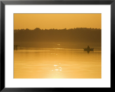Sunset On Lake And Fishing Boat, Lithuania's First National Park, Baltic States by Christian Kober Pricing Limited Edition Print image