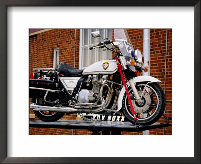 Police Motorcycle Outside Sturgis Motorcycle Museum, Black Hills, South Dakota by Richard Cummins Pricing Limited Edition Print image