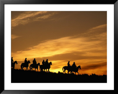 Men Riding Horses At Sunset, U.S.A. by Curtis Martin Pricing Limited Edition Print image
