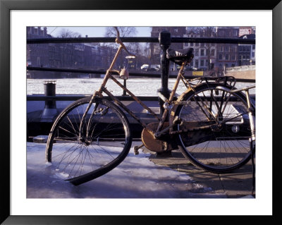 Bicycle Stuck In Frozen Canal, Amsterdam, Netherlands by Michele Molinari Pricing Limited Edition Print image