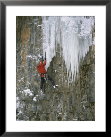 A Man Climbs A Cascade Of Ice In Durango, Colorado by John Burcham Pricing Limited Edition Print image