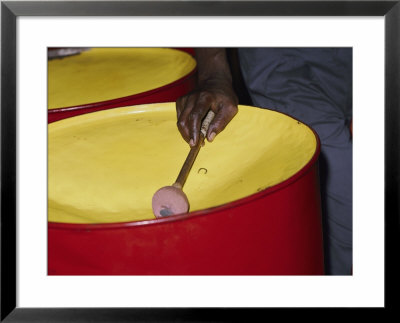 An Island Musician Plays A Brightly Colored Set Of Steel Drums by Todd Gipstein Pricing Limited Edition Print image