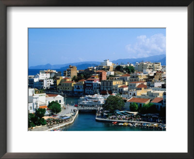 Town Buildings And Lake Voulismeni With Ocean In Distance, Agios Nikolaos, Greece by John Elk Iii Pricing Limited Edition Print image
