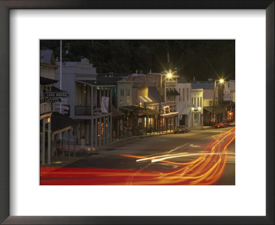 Car Lights At Night In The Gold Rush Town Of Angels Camp, California by Phil Schermeister Pricing Limited Edition Print image