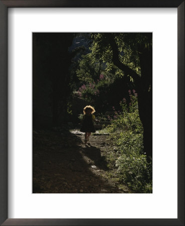 A Child Plays In A Garden In Provence by Nicole Duplaix Pricing Limited Edition Print image