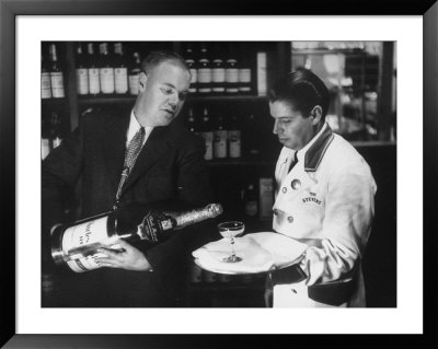 Pouring Champagne From A Huge Tilted Toward Glass Held On Tray By Waiter, At The Hotel Hilton by Ralph Crane Pricing Limited Edition Print image