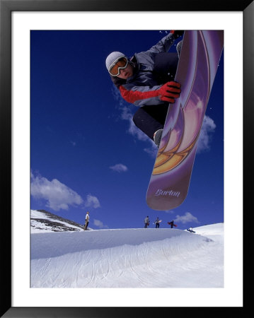 Snowboarder With Colorful Board Doing A Trick by Kurt Olesek Pricing Limited Edition Print image