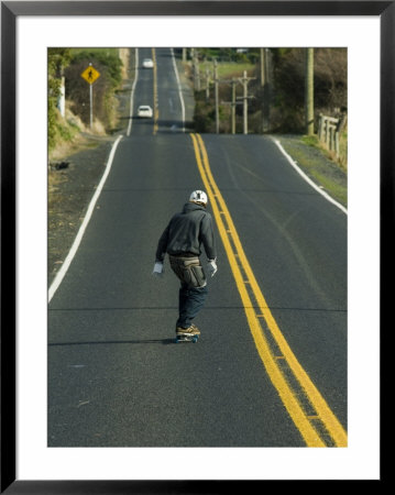 Man Longboarding Down Road, Dunedin, New Zealand by Christian Aslund Pricing Limited Edition Print image