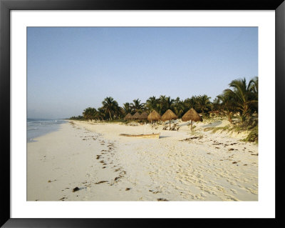 Thatch Umbrellas And A Canoe On A Deserted Tropical Beach by Wolcott Henry Pricing Limited Edition Print image