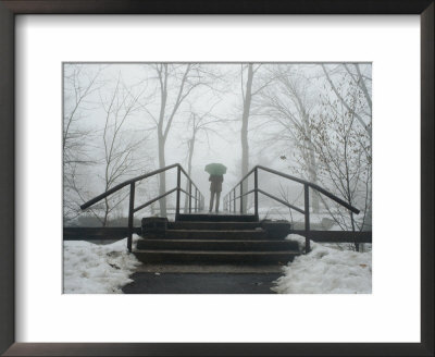 Railings Of A Small Bridge Frame A Lone Figure With An Umbrella by Stephen St. John Pricing Limited Edition Print image
