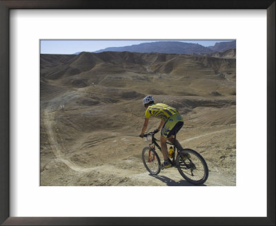 Back View Of Competitior Riding Downhill In Mount Sodom International Mountain Bike Race, Israel by Eitan Simanor Pricing Limited Edition Print image