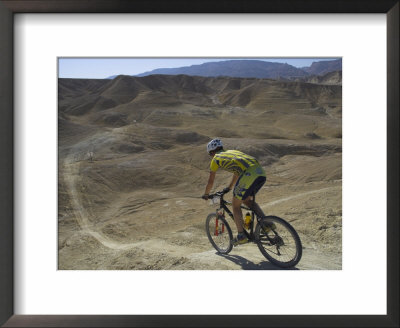 Back View Of Competitior Riding Downhill In Mount Sodom International Mountain Bike Race, Israel by Eitan Simanor Pricing Limited Edition Print image