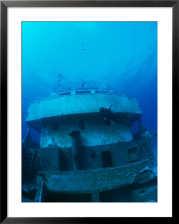 A Diver Exploring A Shipwreck by Nick Caloyianis Pricing Limited Edition Print image