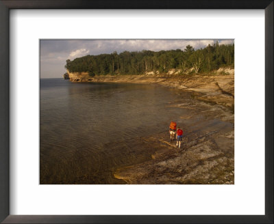 Backpackers At The Mouth Of The Mosquito River, Pictured Rocks National Lakeshore, Michigan by Phil Schermeister Pricing Limited Edition Print image