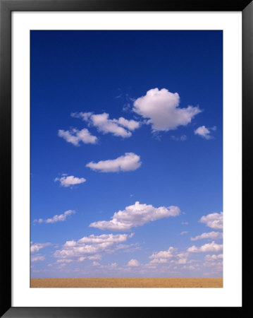 Cumulus Clouds Above A Wyoming Prairie In Late Summer by John Eastcott & Yva Momatiuk Pricing Limited Edition Print image