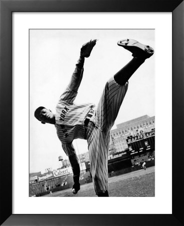 Satchel Paige, Pitcher For Ny Black Yankees Showing Off His High Kick Delivers Cannonball Pitch by George Strock Pricing Limited Edition Print image