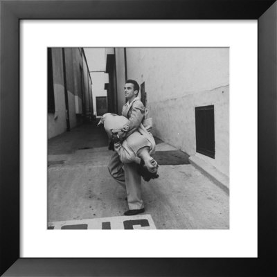 Montgomery Clift Lifting Elizabeth Taylor Off The Ground by Peter Stackpole Pricing Limited Edition Print image