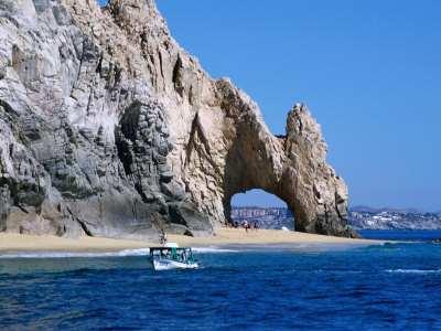 Tour Boat In The Water By El Arco, A Natural Arch At Land's End,Cabo San Lucas, Mexico by Lee Foster Pricing Limited Edition Print image