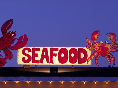 Seafood Sign At Night, Cape Breton, Nova Scotia, Canada by Walter Bibikow Pricing Limited Edition Print image