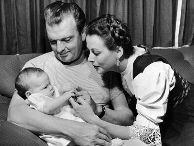 Hedy Lamarr Sitting On Couch With Her Husband And Baby by Martha Holmes Pricing Limited Edition Print image