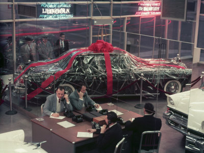 Lincoln Continental At A Car Dealership Wrapped Up With Bow For The Holidays by Yale Joel Pricing Limited Edition Print image