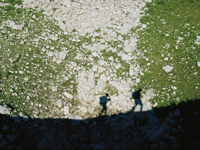 Shadows Cast By Two Men Hiking To The Arabika Cave Base Camp by Stephen Alvarez Pricing Limited Edition Print image