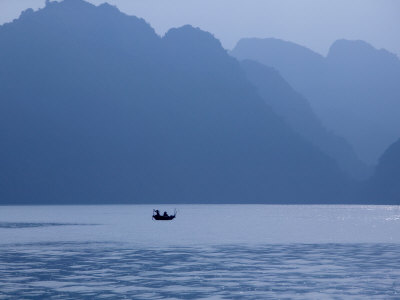 Fisherman In Silhouette At Dawn In Their Fishing Boat by Scott Stulberg Pricing Limited Edition Print image