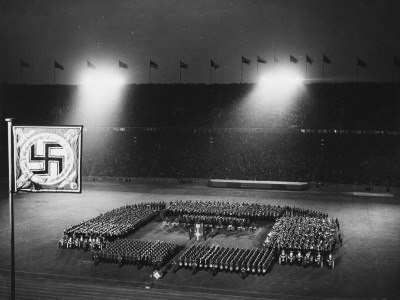 A Military Band In The Olympic Stadium At The 1936 Berlin Olympic Games by Robert Hunt Pricing Limited Edition Print image