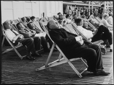 People, Mostly Elderly, Snoozing In Deckchairs On The Brighton Seafront by Henry Grant Pricing Limited Edition Print image
