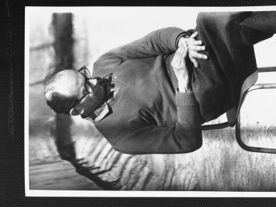 Nazi War Criminal Adolf Eichmann Sitting In Sun In Exercise Yard Outside His Cell At Djalameh Jail by Gjon Mili Pricing Limited Edition Print image