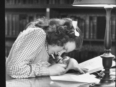 Young Woman Taking Notes On Book In The New York Public Library by Alfred Eisenstaedt Pricing Limited Edition Print image