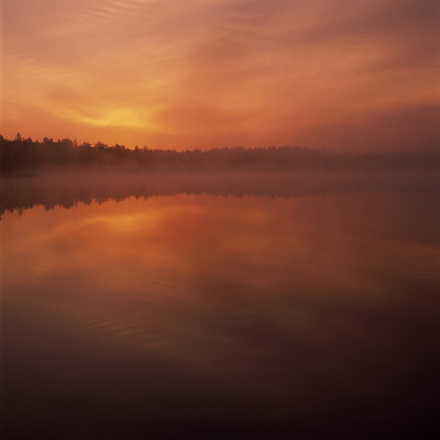 Clouds Over A Lake At Dusk by Ove Eriksson Pricing Limited Edition Print image