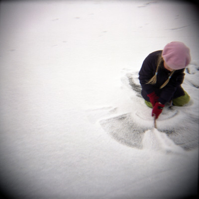 High Angle View Of A Girl Playing In Snow, Sweden by Inger Bladh Pricing Limited Edition Print image
