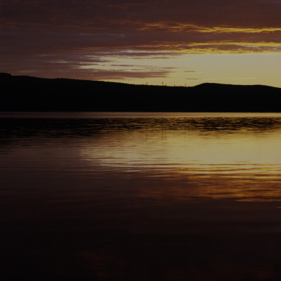 A Lake At Sunset In Halsingland, Sweden by Mikael Andersson Pricing Limited Edition Print image