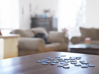 Close-Up Of Jigsaw Pieces On A Table by Atli Mar Pricing Limited Edition Print image